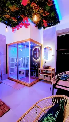 a room with a balcony with a glass door at KosyKasa SPA in Cannes