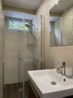 a bathroom with a sink and a shower at HEART OF OLD TOWN - BEACH 150m & PALAIS DES FESTIVALS 600m in Cannes