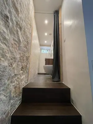 a staircase leading to a bathroom with a bath tub at HEART OF OLD TOWN - BEACH 150m & PALAIS DES FESTIVALS 600m in Cannes