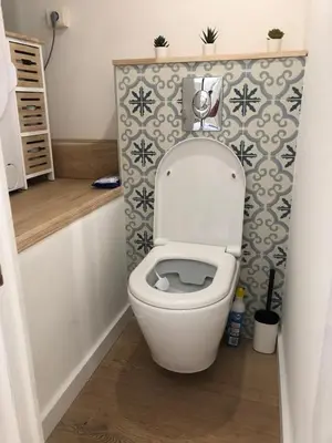 a bathroom with a white toilet in a room at Cocon Forville - Palais des Festivals, Plages, clim, marché provençal, Vieux Port et Suquet in Cannes