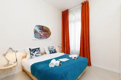 a bedroom with a bed with towels on it at Gazagnaire YourHostHelper in Cannes