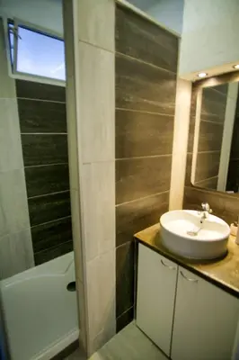 a bathroom with a sink and a bath tub at Ref SELV -Palmes d'Or Properties in Cannes
