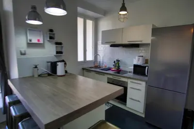a kitchen with a counter top and a refrigerator at Ref SELV -Palmes d'Or Properties in Cannes