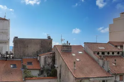 a view of roofs of buildings in a city at STANDING - NEUF - Croisette- Palais des festivals - 6 pers -3 chbres in Cannes