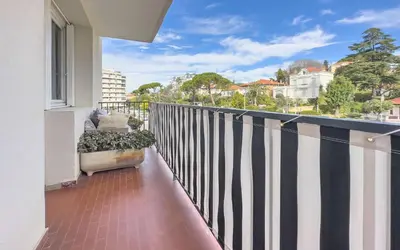 a balcony with a black and white striped fence at Le Selvosa by Winsome Destination in Cannes