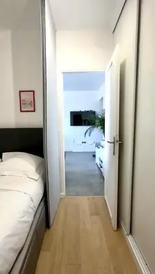 a bedroom with a bed and a large mirror at Le Selvosa by Winsome Destination in Cannes