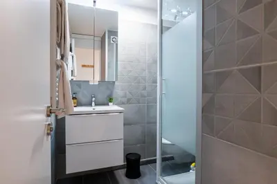 a bathroom with a sink and a shower at 1-Br apartment close to the beaches in Cannes