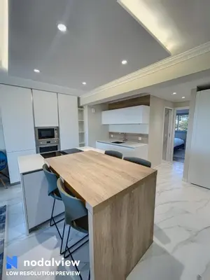 a kitchen with a wooden counter top in a room at Cannes Appartement 3 pièces vue mer in Cannes