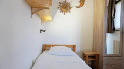a small bedroom with a bed and a window at Appartement 616, 5 personnes belle vue Mer By Palmazur Vacances in Cannes