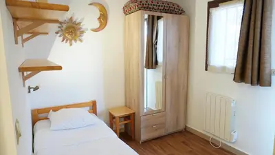 a bedroom with a bed and a mirror and a window at Appartement 616, 5 personnes belle vue Mer By Palmazur Vacances in Cannes