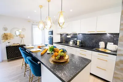 a kitchen with a table with fruits and vegetables on it at Elena YourHostHelper in Cannes