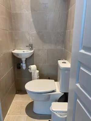 a bathroom with a toilet and a sink at 2chambres 2 salles de bains Palais des Festivals in Cannes