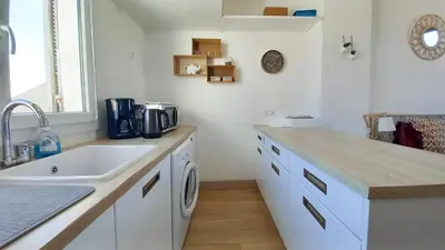 a kitchen with a sink and a counter top at Palais Gounod in Cannes