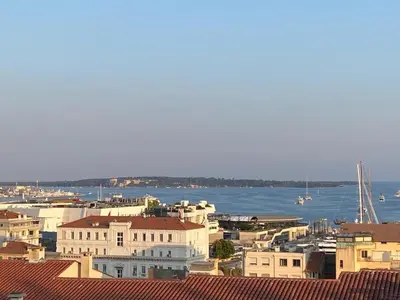 a view of a city with the water and buildings at Chenonceau in Cannes