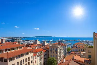 a view of a city with buildings and the ocean at Tulette in Cannes