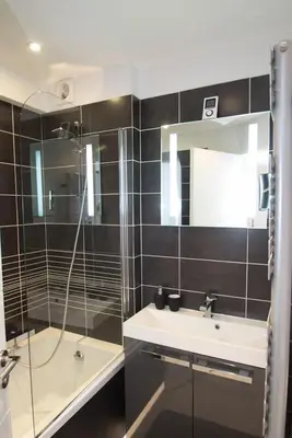 a bathroom with a sink and a mirror at Johnny in Cannes