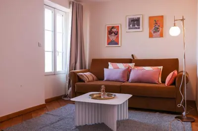 a living room with a couch and a table at IMMOGROOM - Bright and Cosy - SUQUET - next to the beaches - AC in Cannes