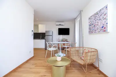 a living room with a table and chairs at IMMOGROOM - Beautiful and cosy- Suquet- near the beaches - AC in Cannes