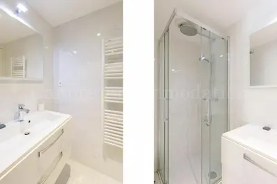 a white bathroom with a shower and a sink at HSUD0118 Terracotta in Cannes