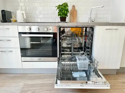 a dishwasher with dishes in it in a kitchen at Maison La Casetta (2ch / 2sdb) - Le Suquet Cannes in Cannes