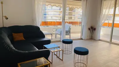 a living room with a couch and a table at le meilleur de Cannes au palm beach in Cannes