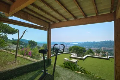 a view from a house with a golf course at Cannes - Modern villa with 180° sea view in Vallauris