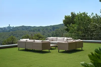 two couches sitting on top of a field of grass at Cannes - Modern villa with 180° sea view in Vallauris