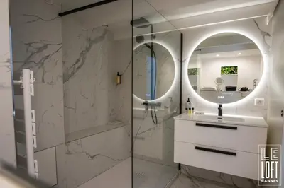 a bathroom with a sink and a mirror at Le loft Cannes in Cannes