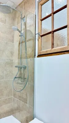 a bathroom with a shower with a glass door at La Bohème Cosy Apt Near Beach AC Near festival in Cannes
