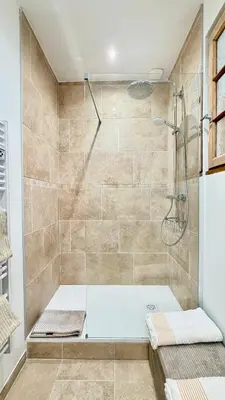 a bathroom with a shower with a tub at La Bohème Cosy Apt Near Beach AC Near festival in Cannes