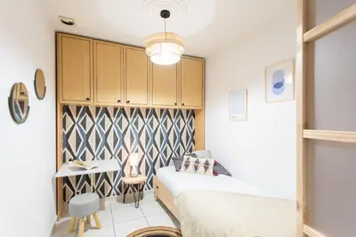 a bedroom with a bed and a desk in it at C16 - 2 BDR Rue Antibes 4 min Palais Festivals - AC & Terrace in Cannes