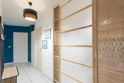a hallway with a sliding glass closet door at C16 - 2 BDR Rue Antibes 4 min Palais Festivals - AC & Terrace in Cannes