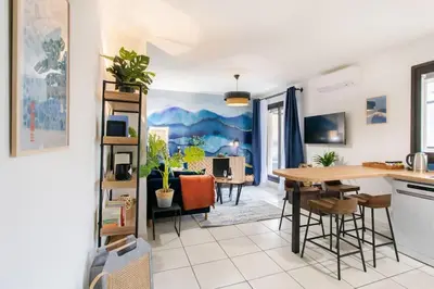 a kitchen and living room with a table and chairs at C16 - 2 BDR Rue Antibes 4 min Palais Festivals - AC & Terrace in Cannes