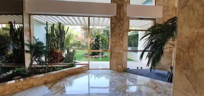 an indoor pool with plants in a building at Villa sur le toit - Vue mer exceptionnelle in Cannes