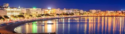 a bridge over a river in a city at night at 06AG - Bel appartement proche Palais des Festivals in Cannes