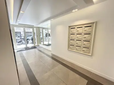 a hallway with a painting on the wall at 1 bedroom Latour Maubourg Cannes Riviera 245 in Cannes