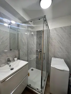 a bathroom with a shower and a sink and a toilet at V Park by Welcome to Cannes in Cannes