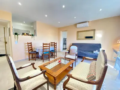 a living room with a couch and chairs and a table at Palais Azur By SCLS Locations in Cannes