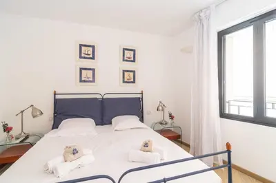 a bedroom with a bed with towels on it at Cannes Rue d'Antibes Premium 2 BDR 2 baths Exclusive Olam Properties in Cannes
