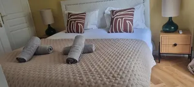 a bedroom with a large bed with four pillows at Cannes Meynadier: Superbe appartement trois pièces in Cannes
