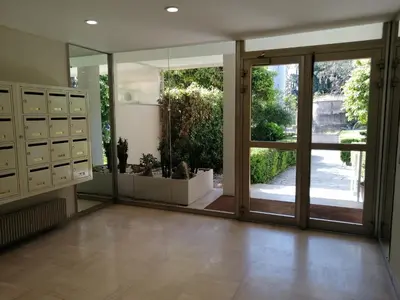 a large room with sliding glass doors and a patio at Résidence Côte d'Azur Cannes in Cannes