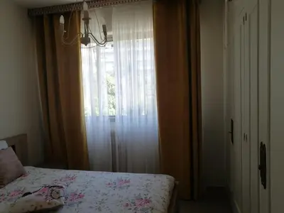 a bedroom with a bed and a large window at Résidence Côte d'Azur Cannes in Cannes