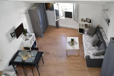 an overhead view of a living room with a couch and a table at Grand studio-Mezzanine-Centre Cannes in Cannes