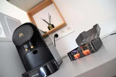 a black coffee machine sitting on a counter at Grand studio-Mezzanine-Centre Cannes in Cannes