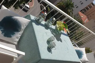 a balcony with a table with a plant on it at Centre et plage tout à pied échappée mer in Cannes