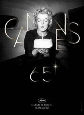 a black and white photo of a woman holding a cake at Centre et plage tout à pied échappée mer in Cannes