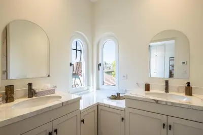 a bathroom with two sinks and two mirrors at Luxurious Villa with heated pool 5BR-10p - Cannes in Cannes
