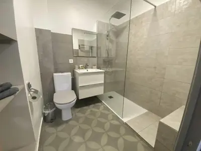 a bathroom with a shower and a toilet and a sink at PACA Properties 41H2 - Studio cosy in Cannes