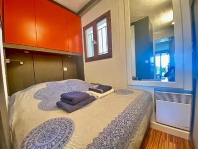 a bedroom with a bed with towels on it at Le Delacroix 2 By SCLS Locations in Cannes