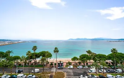 a view of the ocean from a parking lot at 2 Bedroom Cozy Apartment In Cannes in Cannes